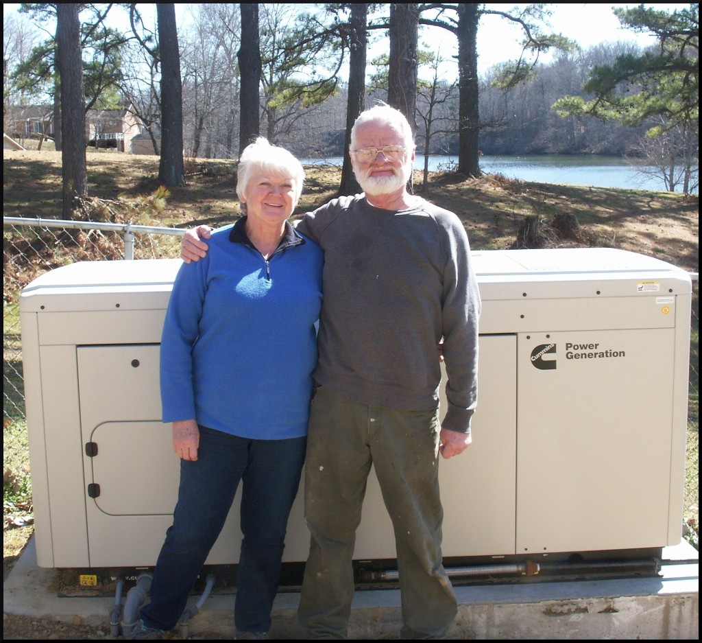 Recent projects include this couple standing in front of their new Cummins RS30 home standby generator