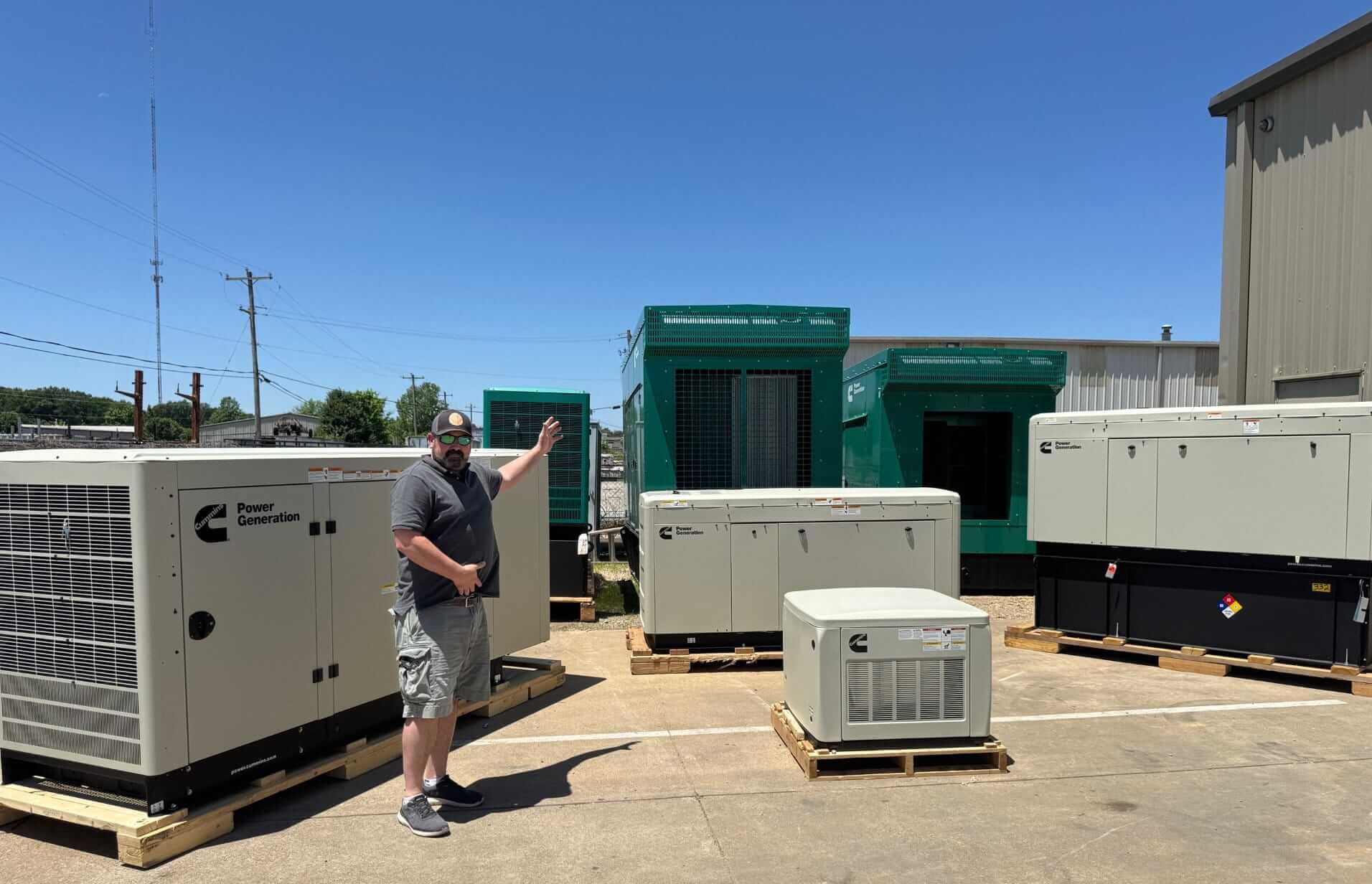David Richey, president of Benchmark Electric points to the many generator options from Cummins for home and business.